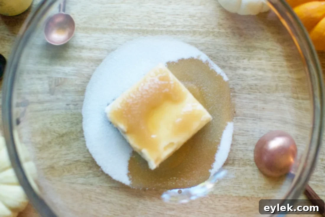 Preparing the cream cheese filling with a handheld mixer