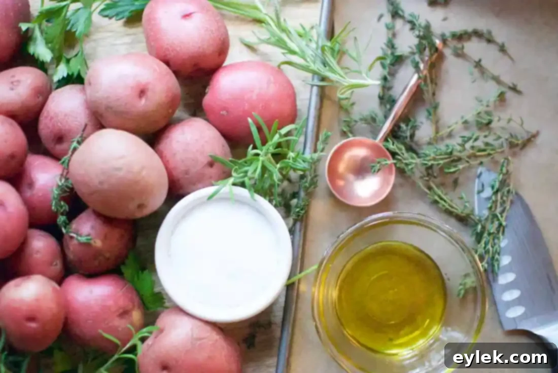 Dressed-Up Herb Roasted Potatoes served on a platter, showcasing the herb garnishes