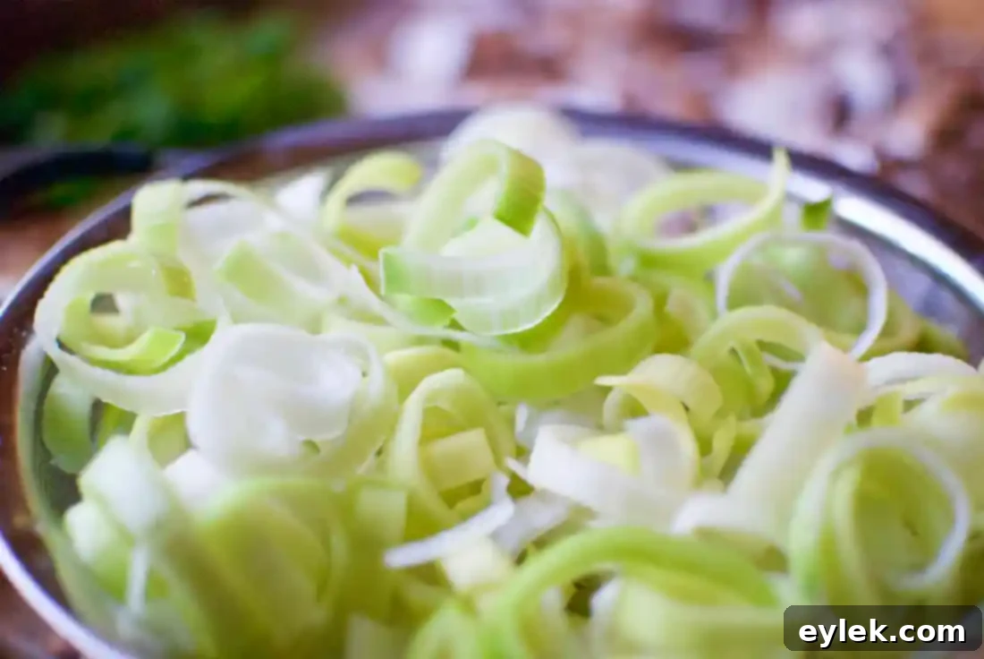 sauteed leeks and mushrooms in a pan