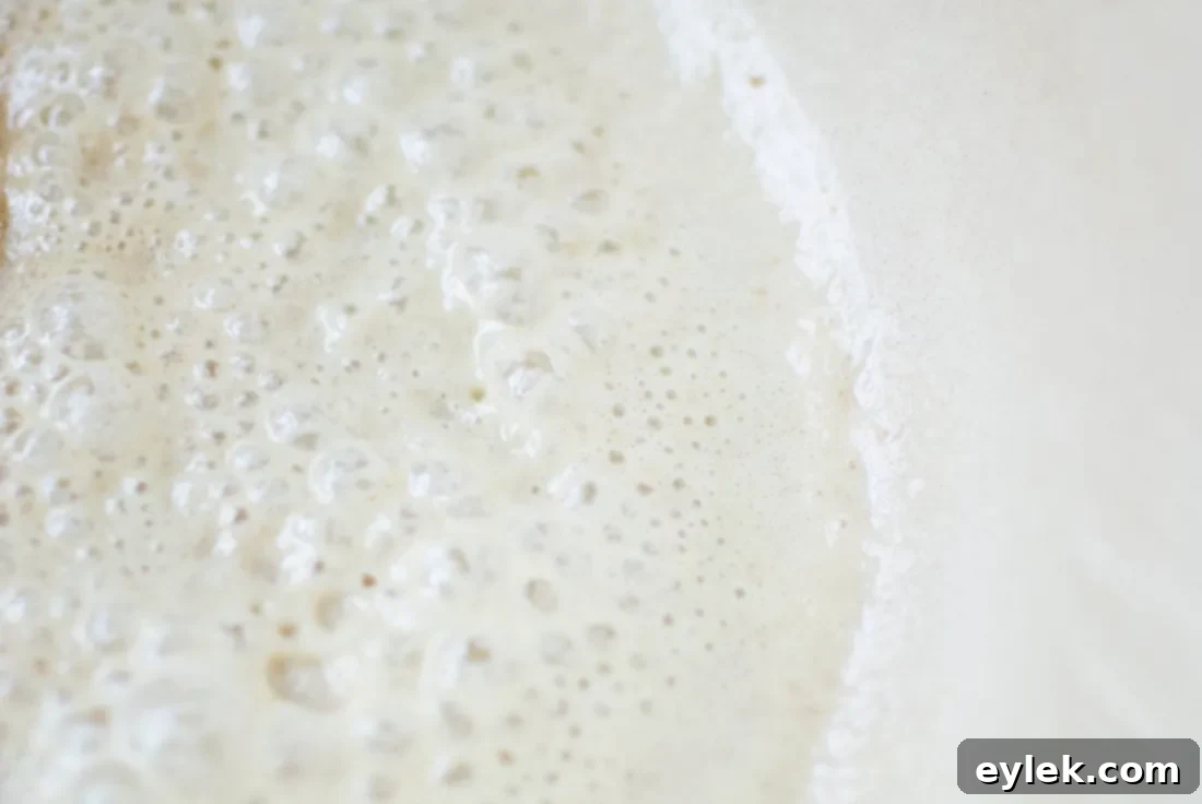 whisking cheese sauce for cavatappi