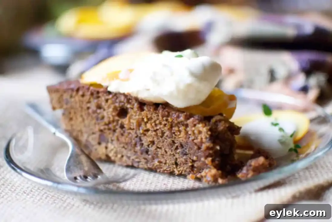 Chocolate Gingerbread Cake cooling on a wire rack in a skillet, still whole