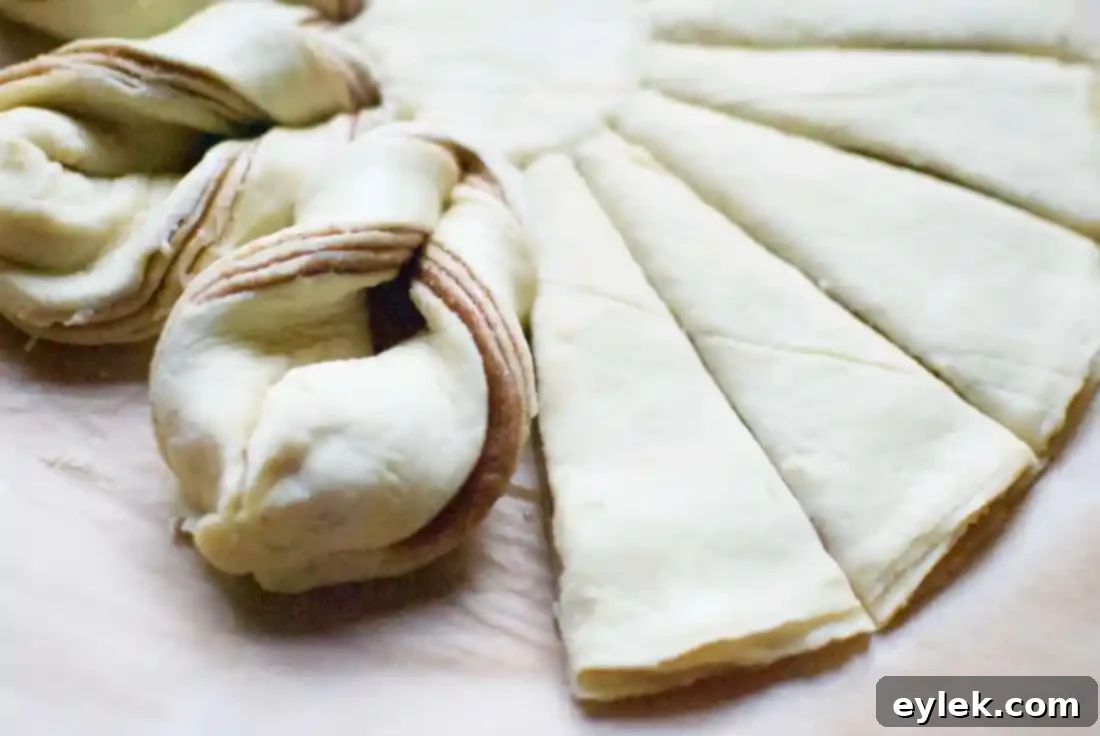 Twisting dough to form a cinnamon star bread
