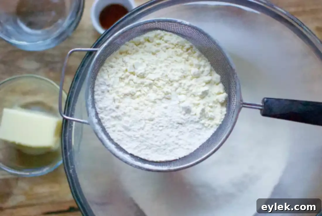 Cinnamon Star Bread ingredients being sifted in a bowl