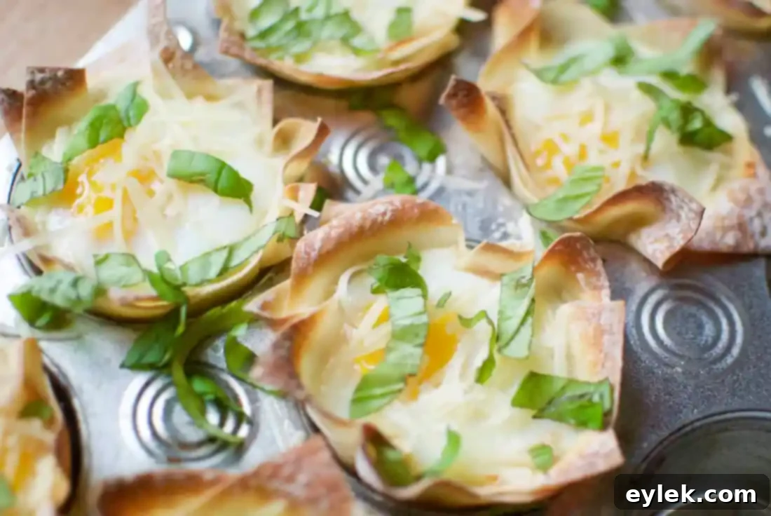 Tray of baked Italian Egg Wonton Cups, fresh from the oven, before garnishing.