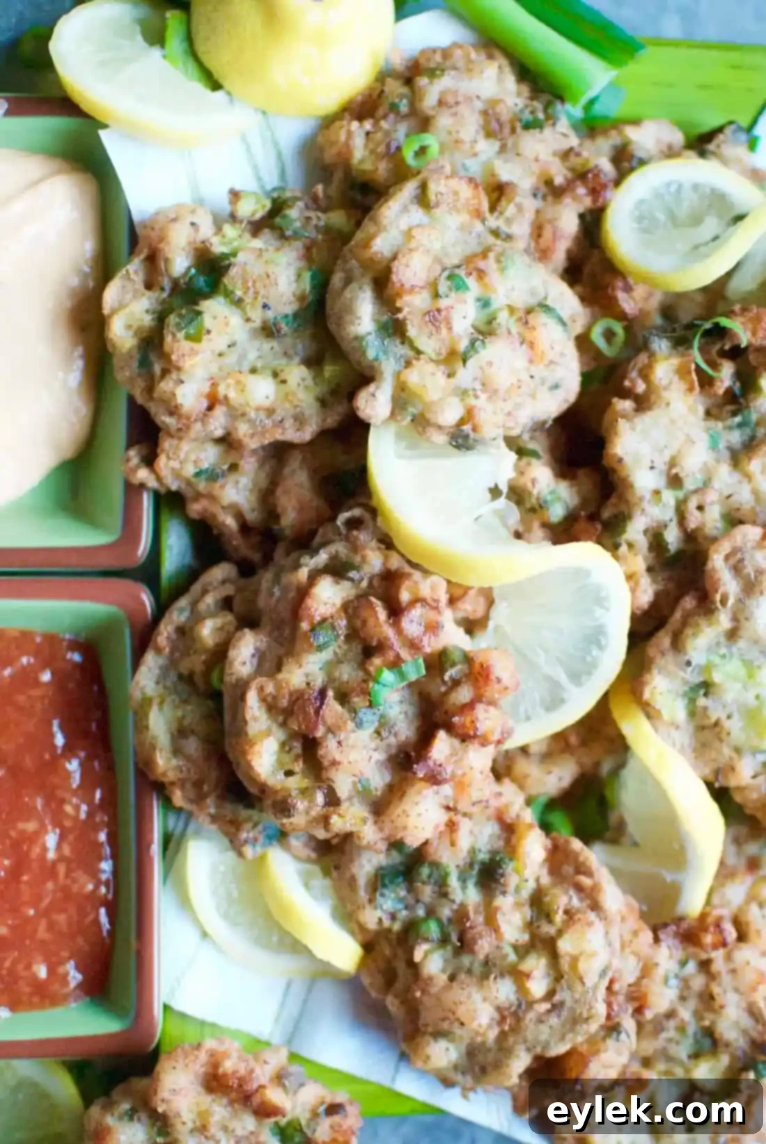 Stacked shrimp and zucchini fritters with fresh lemon