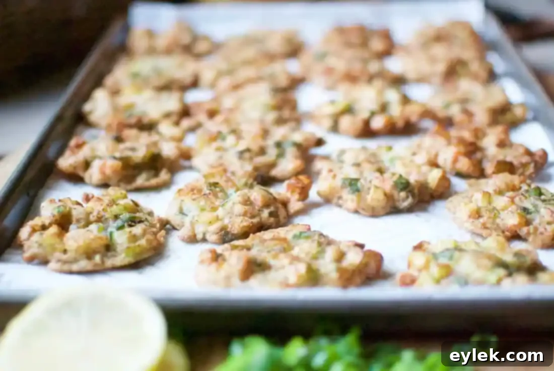Crispy golden shrimp and zucchini fritters on a tray