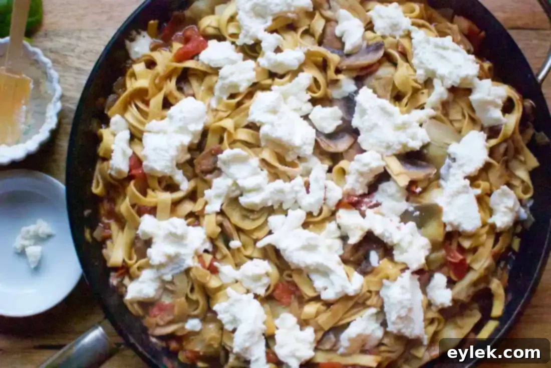 One-pan pasta with melted ricotta and mozzarella cheeses, fresh out of the broiler