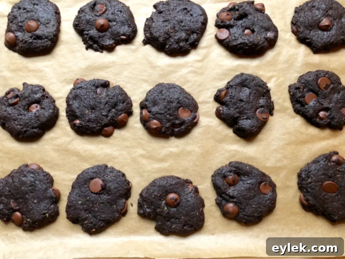 Freshly baked gluten-free mint double chocolate chip cookies cooling on a rack