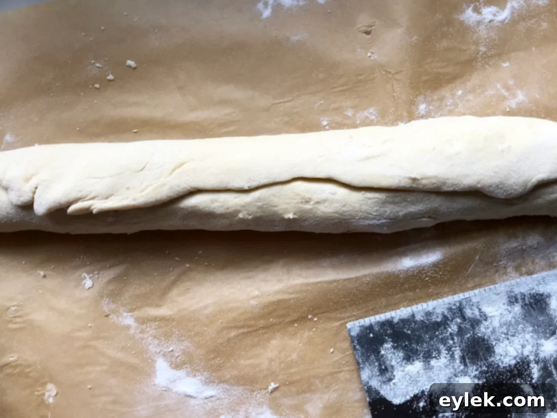 Close-up of the rolled Gluten-Free Blueberry & Lemon Curd log, seam-side down.