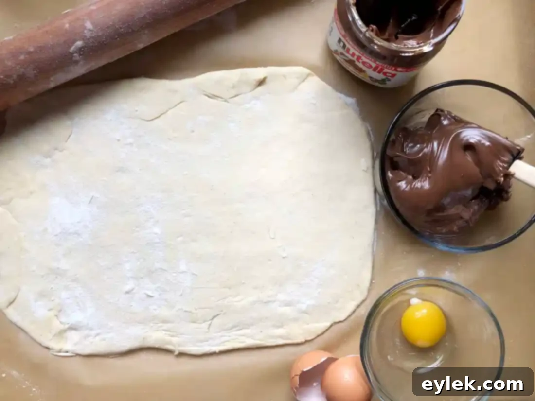 Gluten-Free brioche dough rolled out on a floured surface