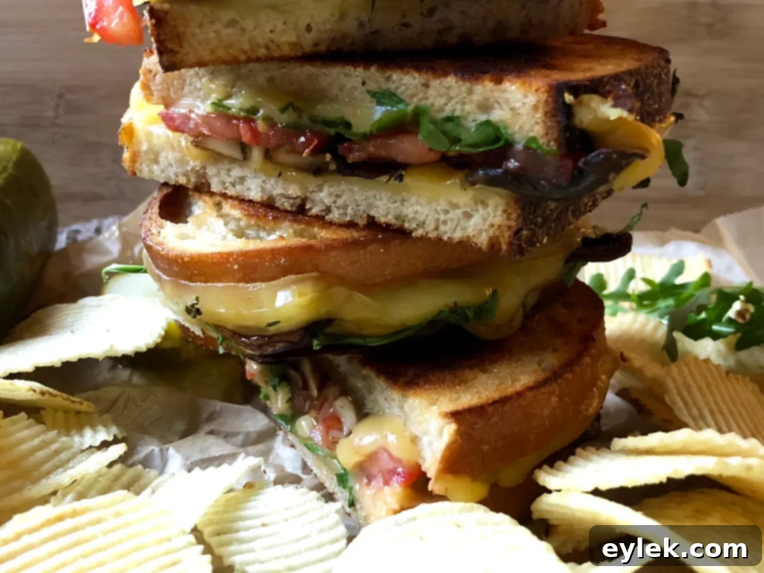 Interior view of a smoked gouda and portabella mushroom grilled cheese sandwich
