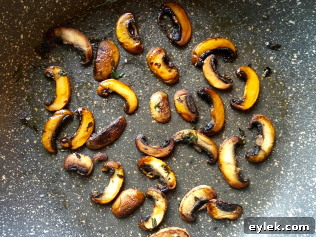 Sautéed portabella mushrooms and fresh thyme leaves