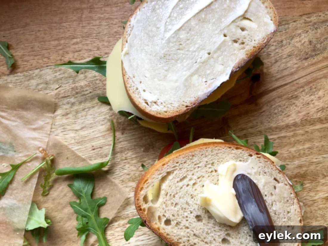 Flipping a grilled cheese sandwich in a pan