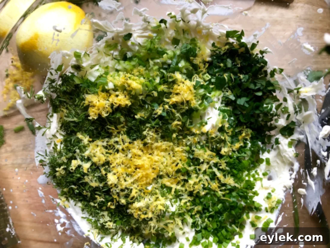 Mixing cream cheese and heavy cream for the dip