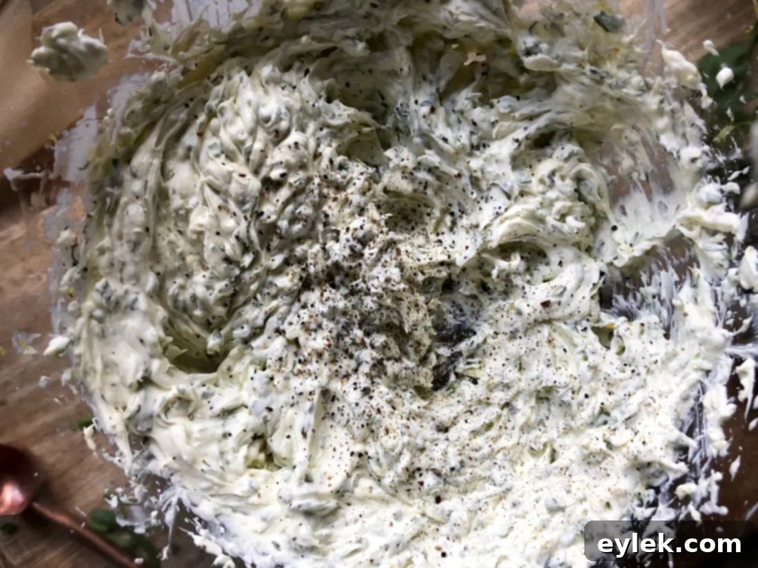 Adding fresh herbs and lemon zest to the creamy dip base