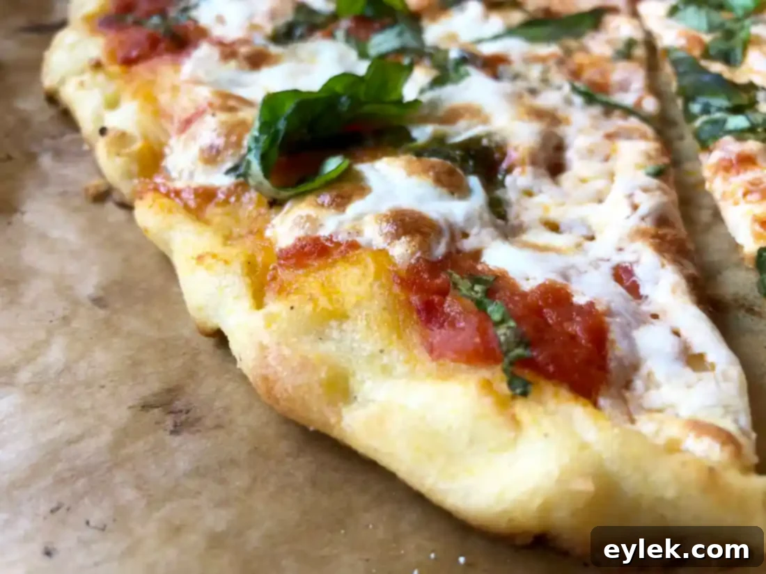 A freshly baked, hot gluten-free pizza Margherita, sliced and ready to be served.