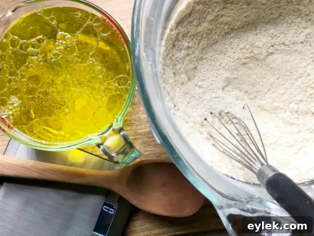 Gluten-free pizza dough after initial mixing, showing a smooth, creamy texture.