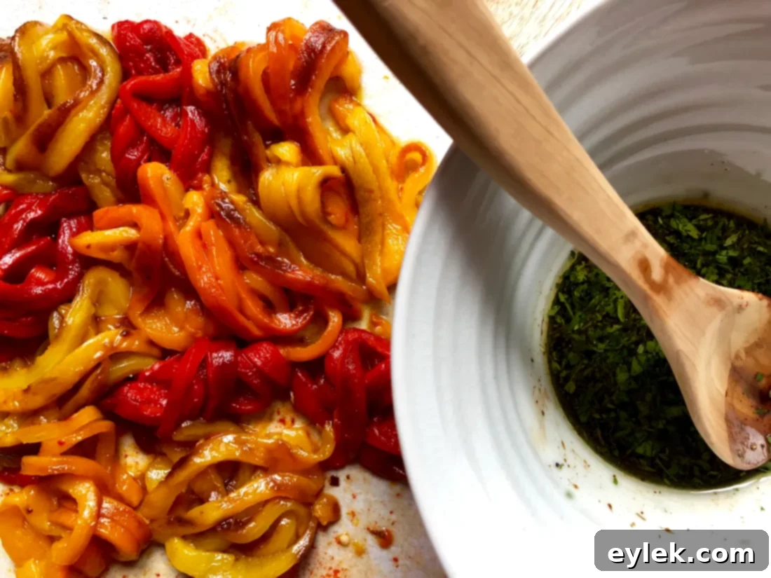Slicing roasted bell peppers into thin strips