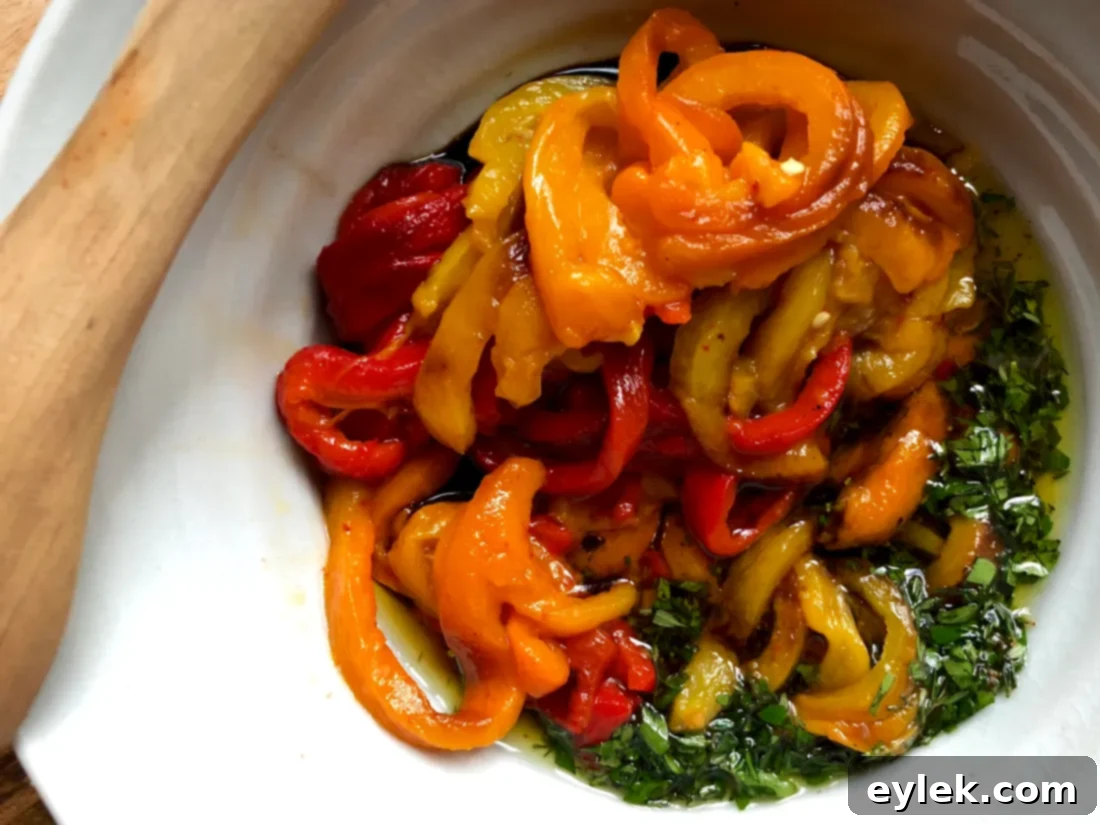 Sliced bell pepper strips being added to the marinade