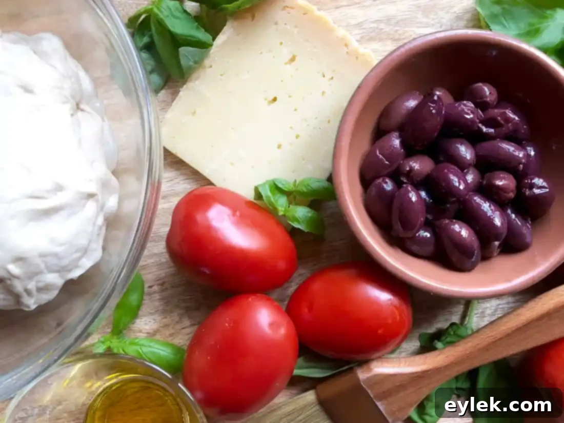 cheesy focaccia with tomatoes & olives
