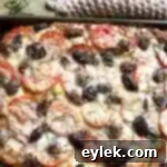 cheesy focaccia with tomatoes & olives
