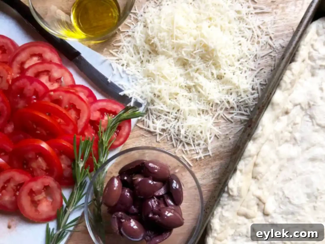 cheesy focaccia with tomatoes & olives