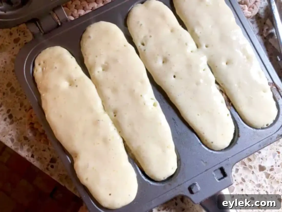 Golden brown waffle sticks fresh out of the pan