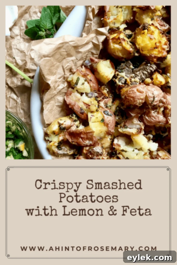 Crispy Smashed Potatoes with Lemon & Feta served on a white platter