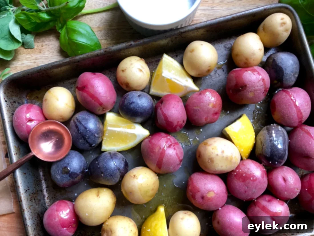 Fork-tender potatoes on a baking sheet, ready for smashing