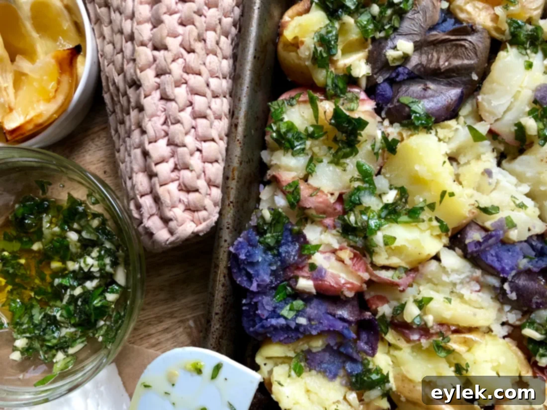 Crispy smashed potatoes baking in the oven, turning golden brown