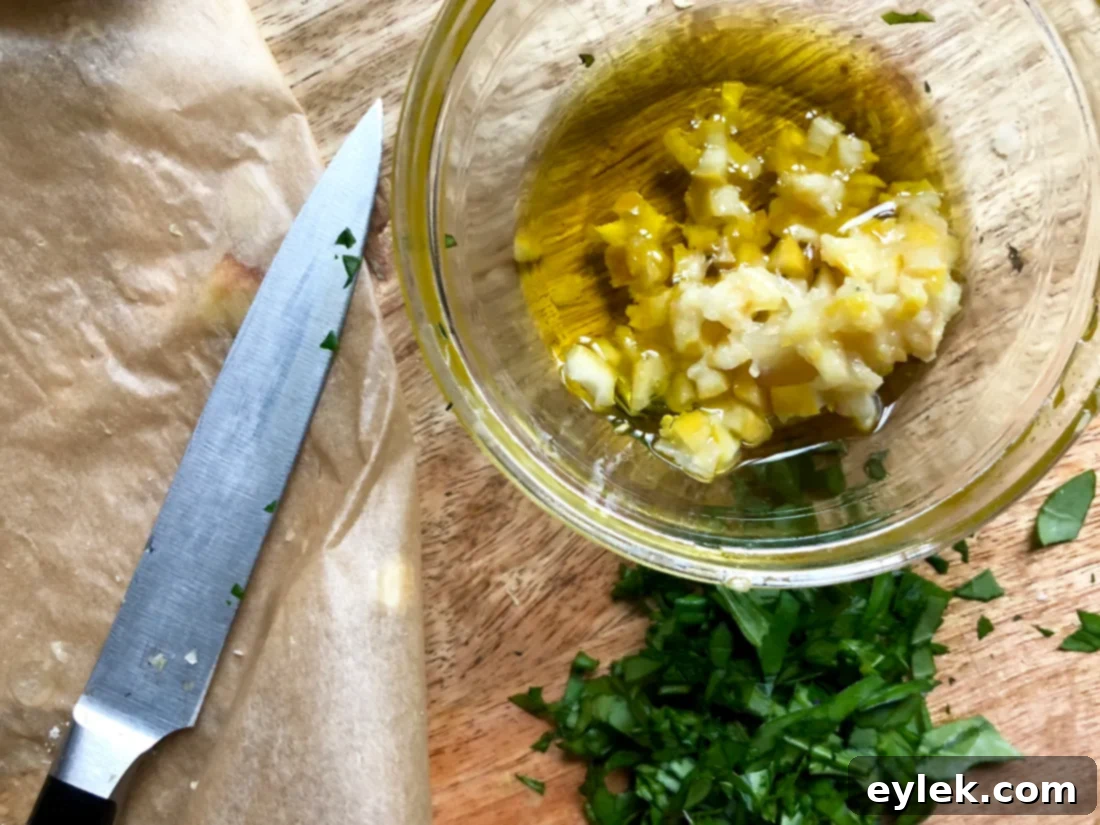 Finely chopped roasted lemon, basil, and olive oil mixture in a small bowl