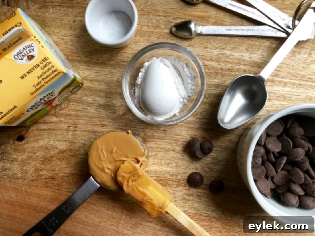 Ingredients for the peanut butter chocolate filling in a bowl, before mixing with hot cream.