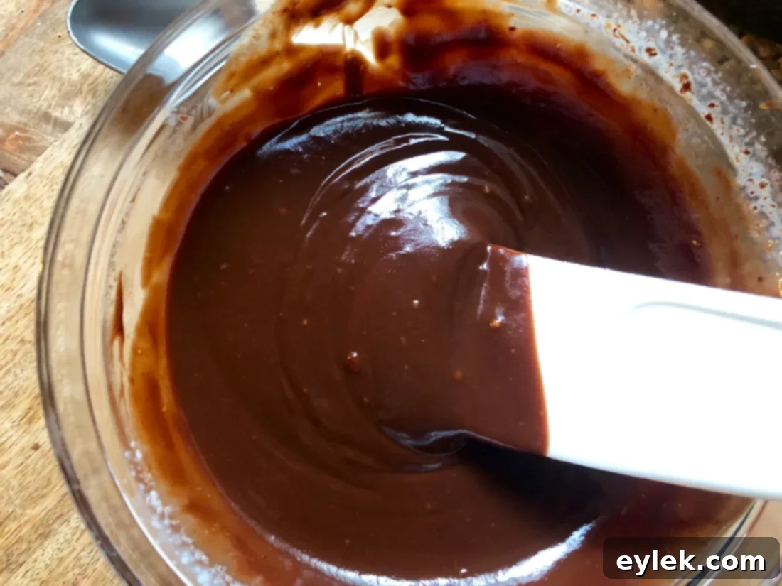 The smooth and creamy peanut butter chocolate filling in a bowl, ready to be chilled.