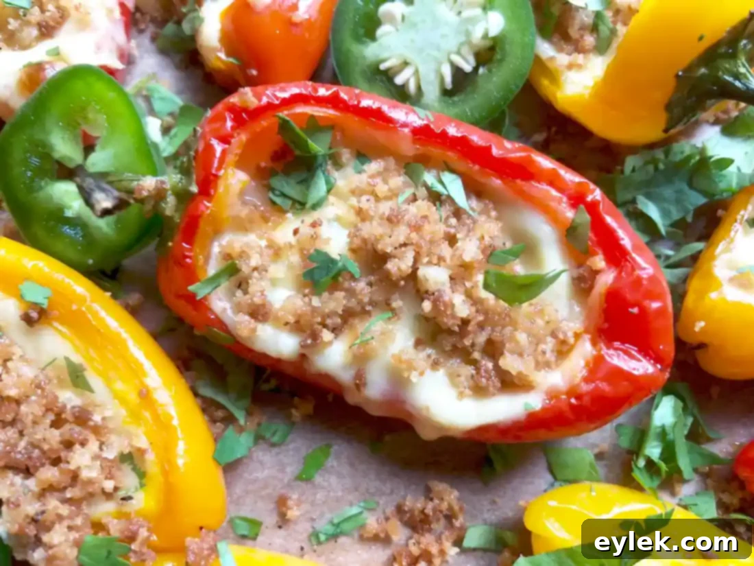 Two plates of finished Queso-Filled Mini Peppers