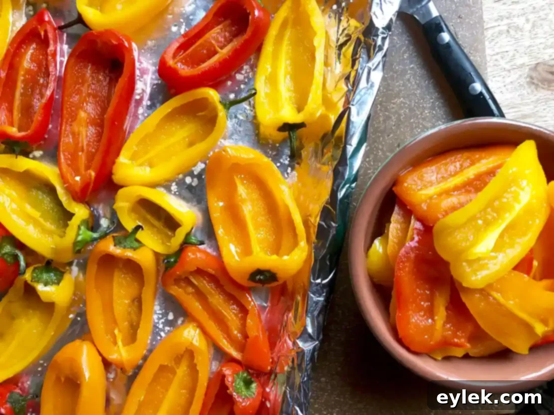 Scooping out seeds from mini peppers