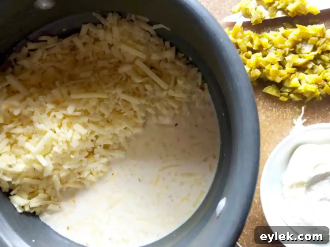 Making creamy queso in a double boiler