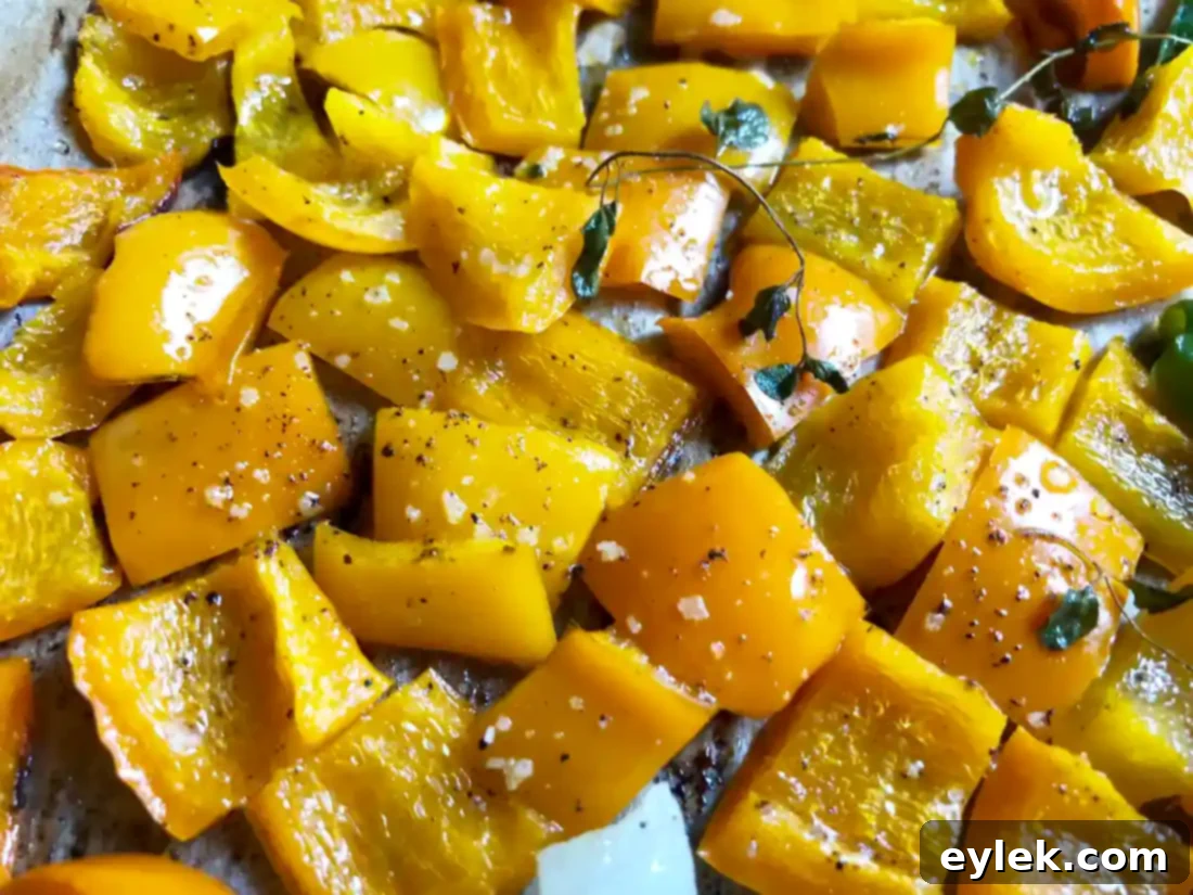 oven-roasted vegetables in groupings on a baking sheet
