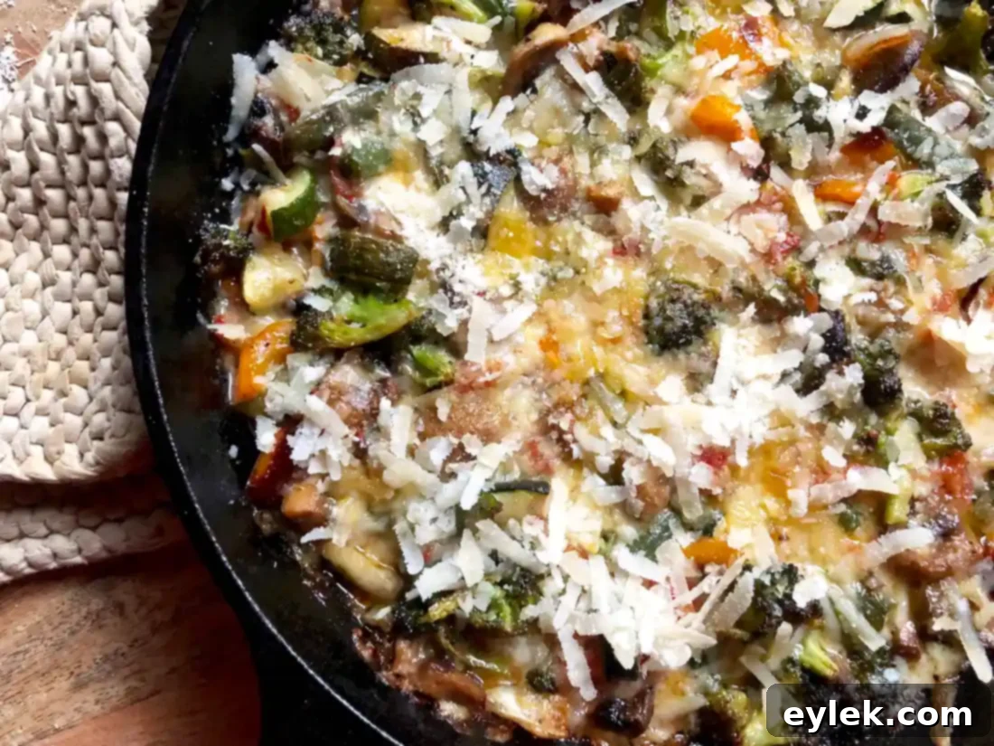 cheesy roasted ratatouille dip with an additional sprinkle of parmesan cheese