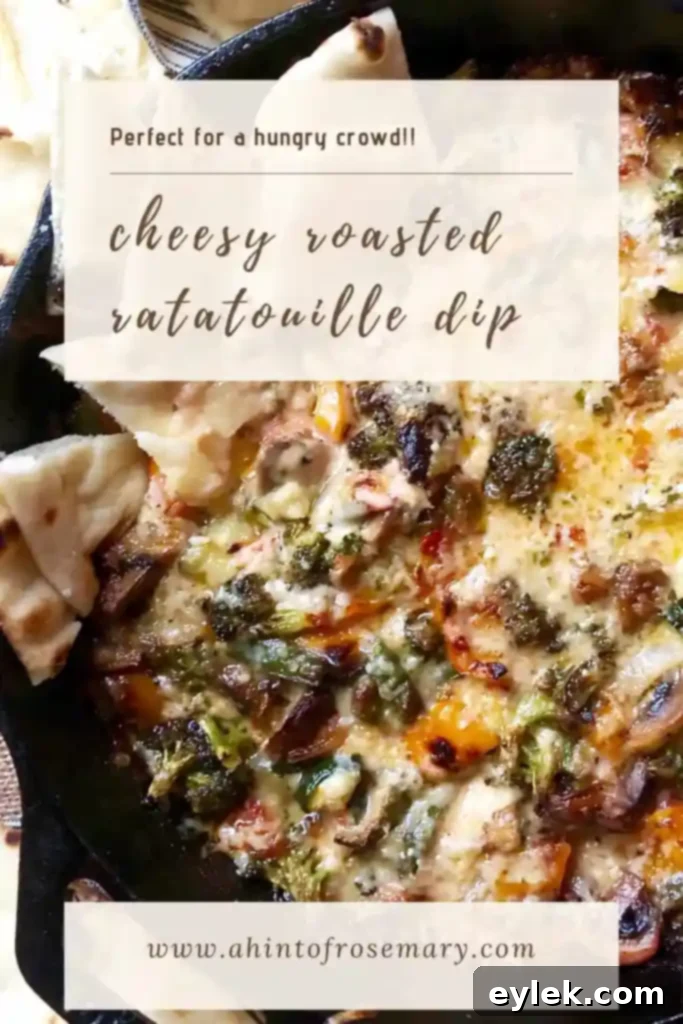 vertical shot of cheesy roasted ratatouille dip in a rustic bowl