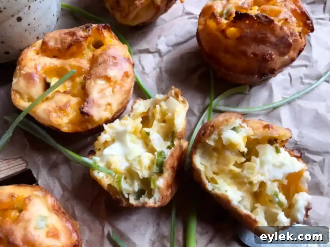 Green Onion & Cheddar Popovers on a cutting board, ready to be served