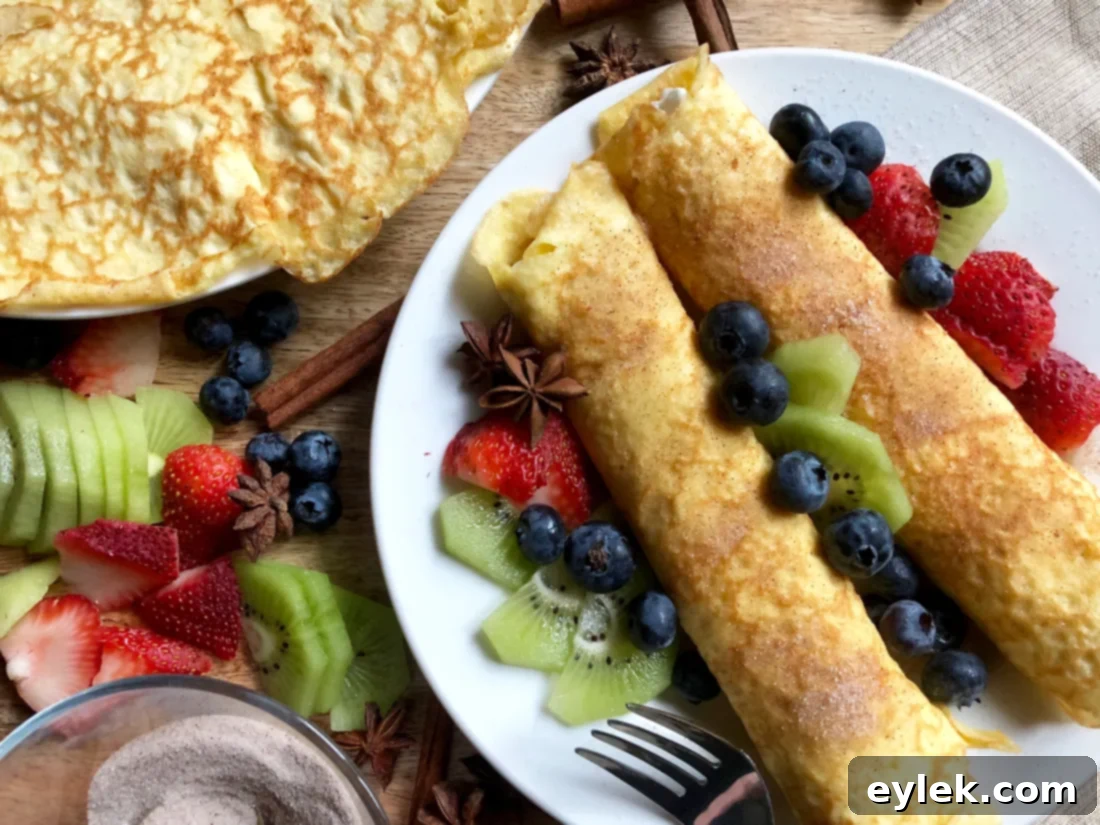 Plate of rolled low-carb crepes (nanashnicki) with cinnamon and sugar substitute