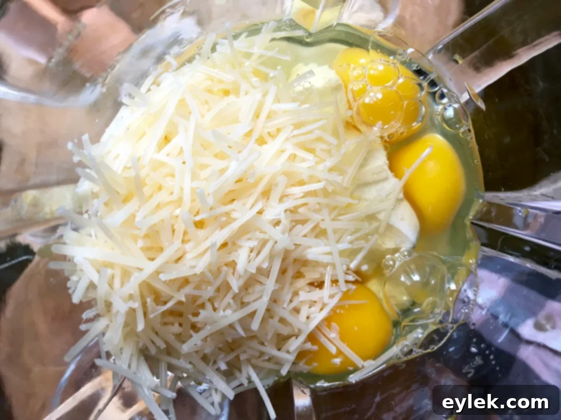 Close-up of low-carb crepe batter in a pan, spreading into a circle.