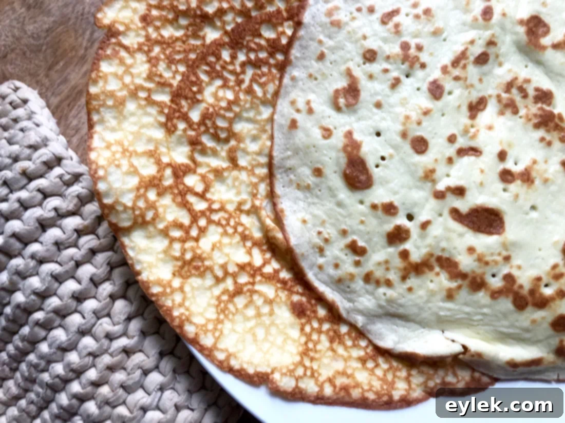 Flipping a low-carb crepe in a pan