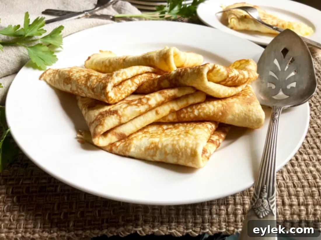 The second side of a low-carb crepe cooking, showing browning