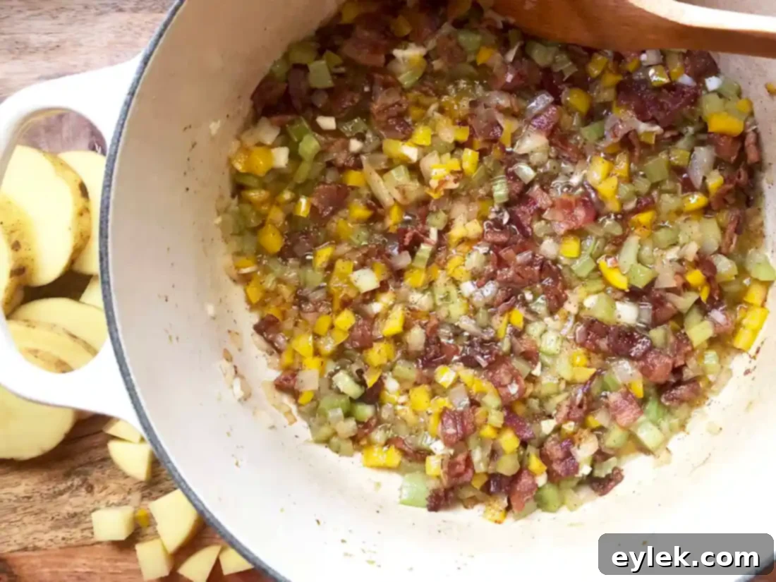 Elevated Manhattan Clam Chowder 11 adding garlic and flour to sautéed vegetables for the chowder base