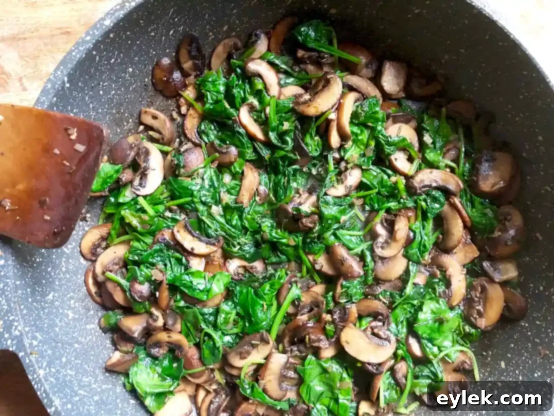 Savory Crepe Egg Rolls filling mixed with spinach
