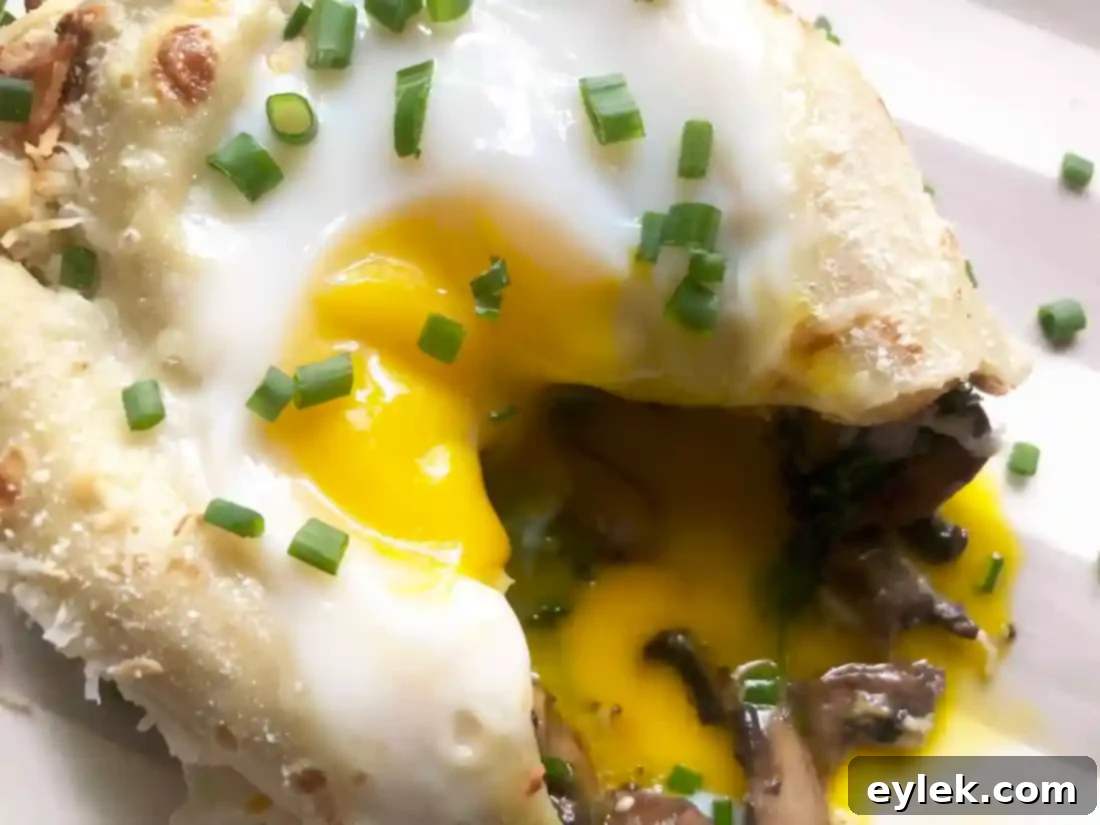 Savory Crepe Egg Rolls cut open to show runny yolk and filling