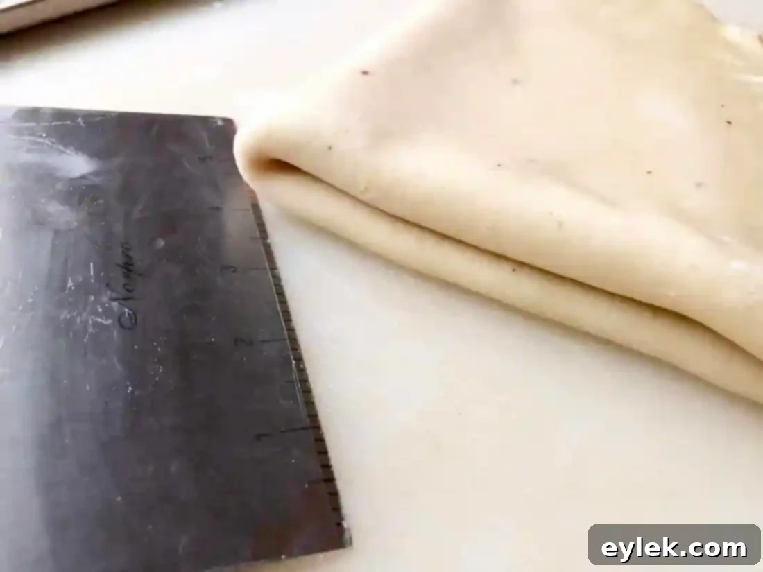 pastry dough in baking pan for ham & cheese slab pie