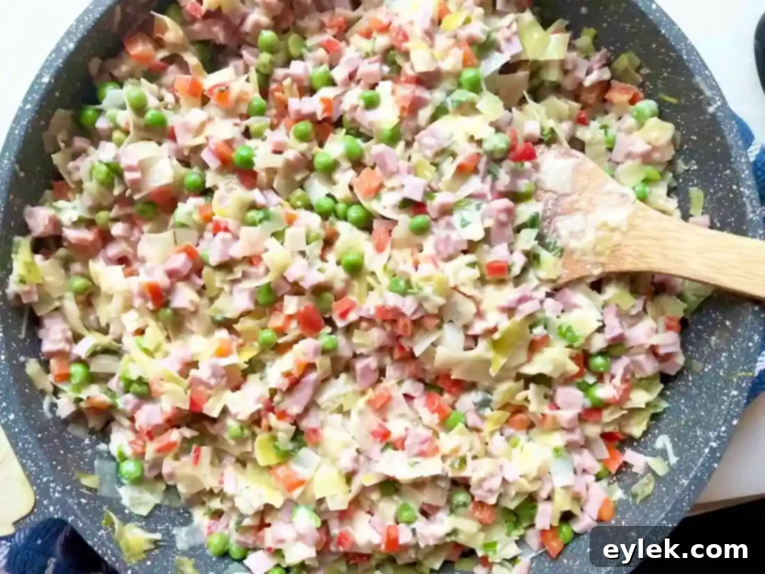 filling spread in ham & cheese slab pie