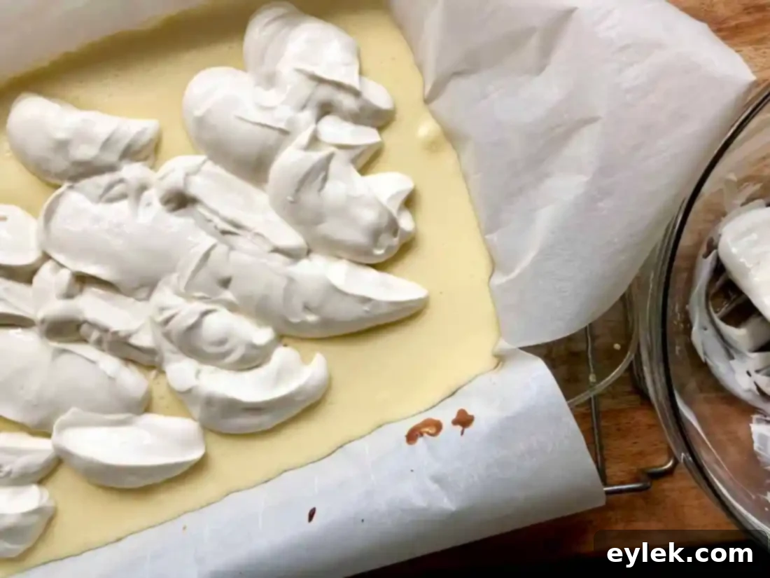Cheesecake with sour cream topping before final bake